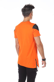 Orange Extended Tshirt With Black Patch On shoulders and Pocket With a Diagonal Cut son Bottom and Zip On Side